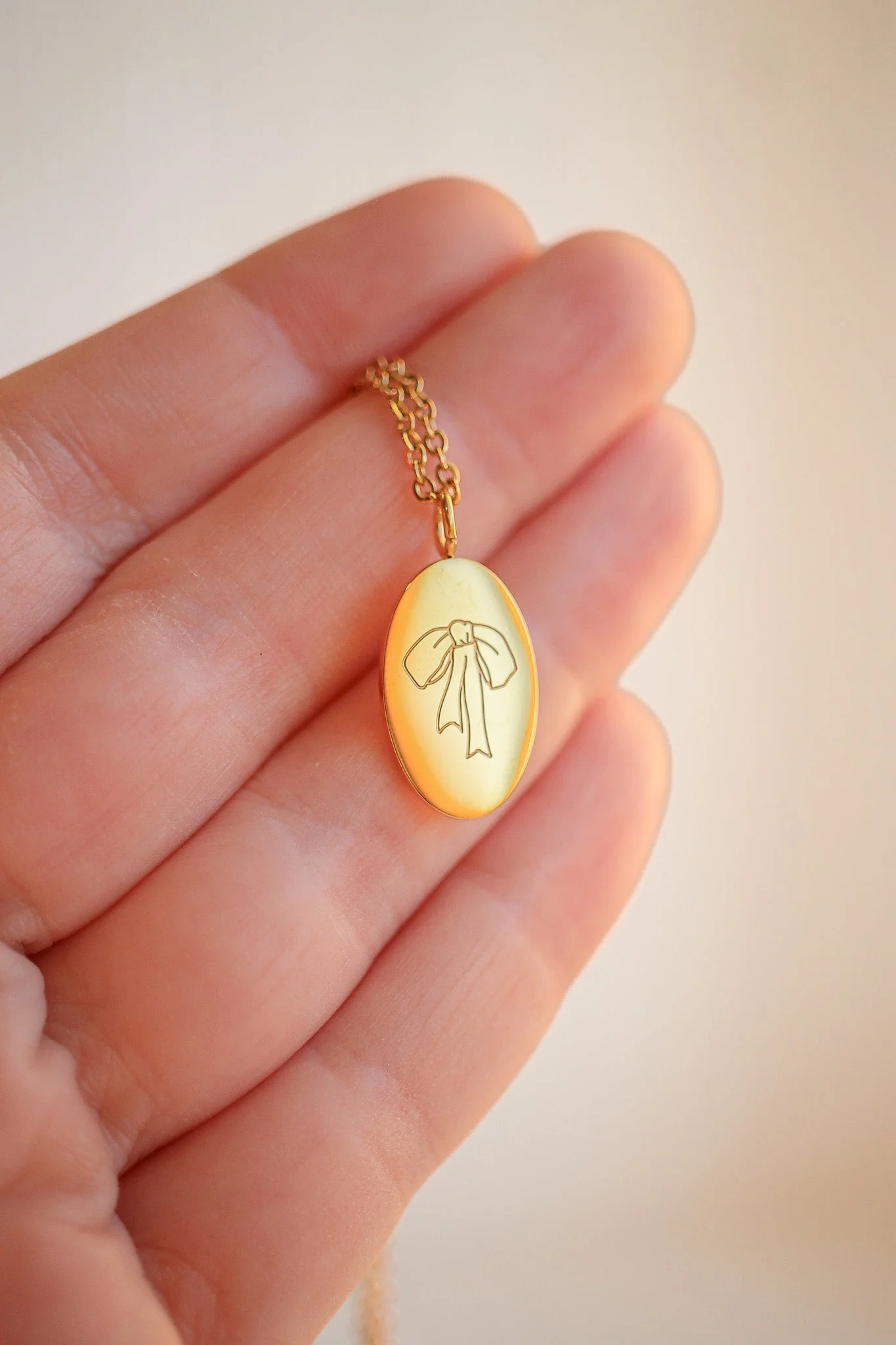 Bow Pendant Necklace in Gold - Image 5